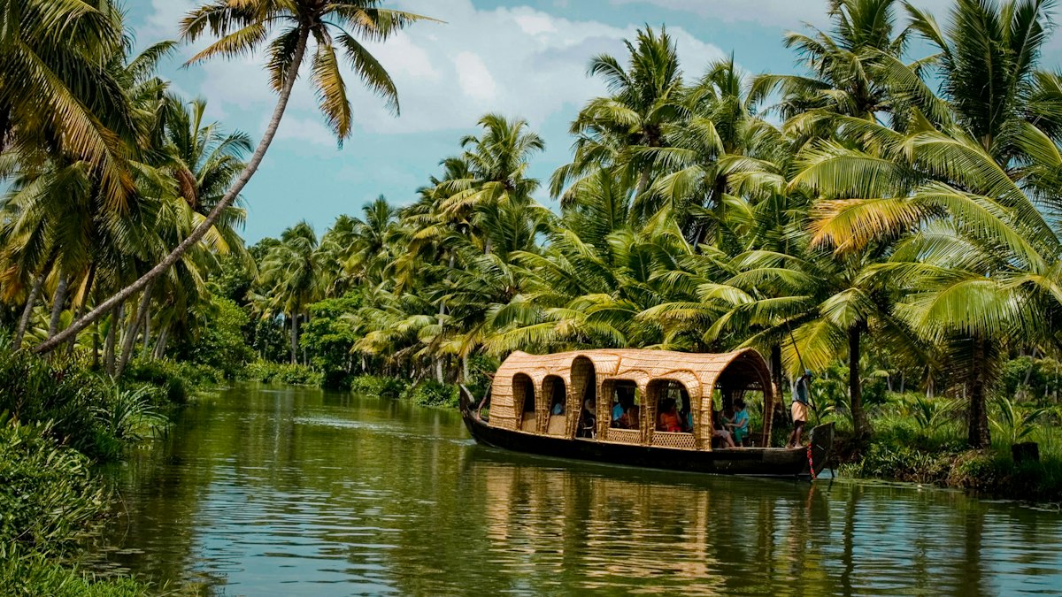 Pathiramanal green island in Lake Vembanad Kerala surrounded by calm waters and tropical vegetation