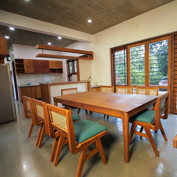 Solid Teak Dining Hall & Open Living at Norah Retreat Homestay Kaduthuruthy